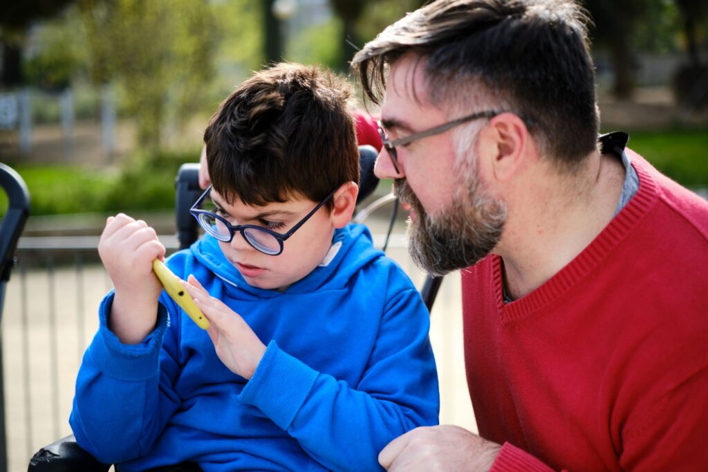 dad with special needs child in wheelchair