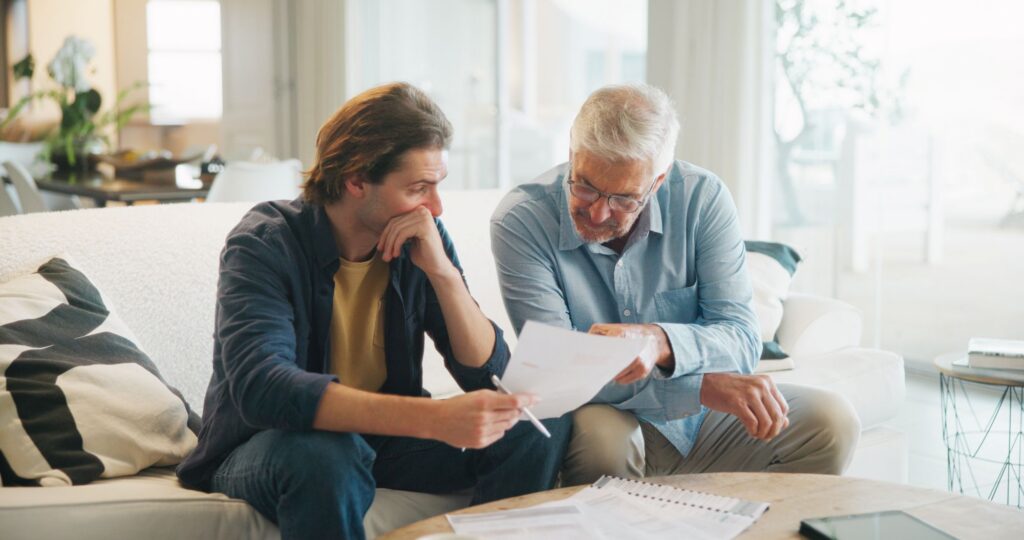 adults looking at paperwork
