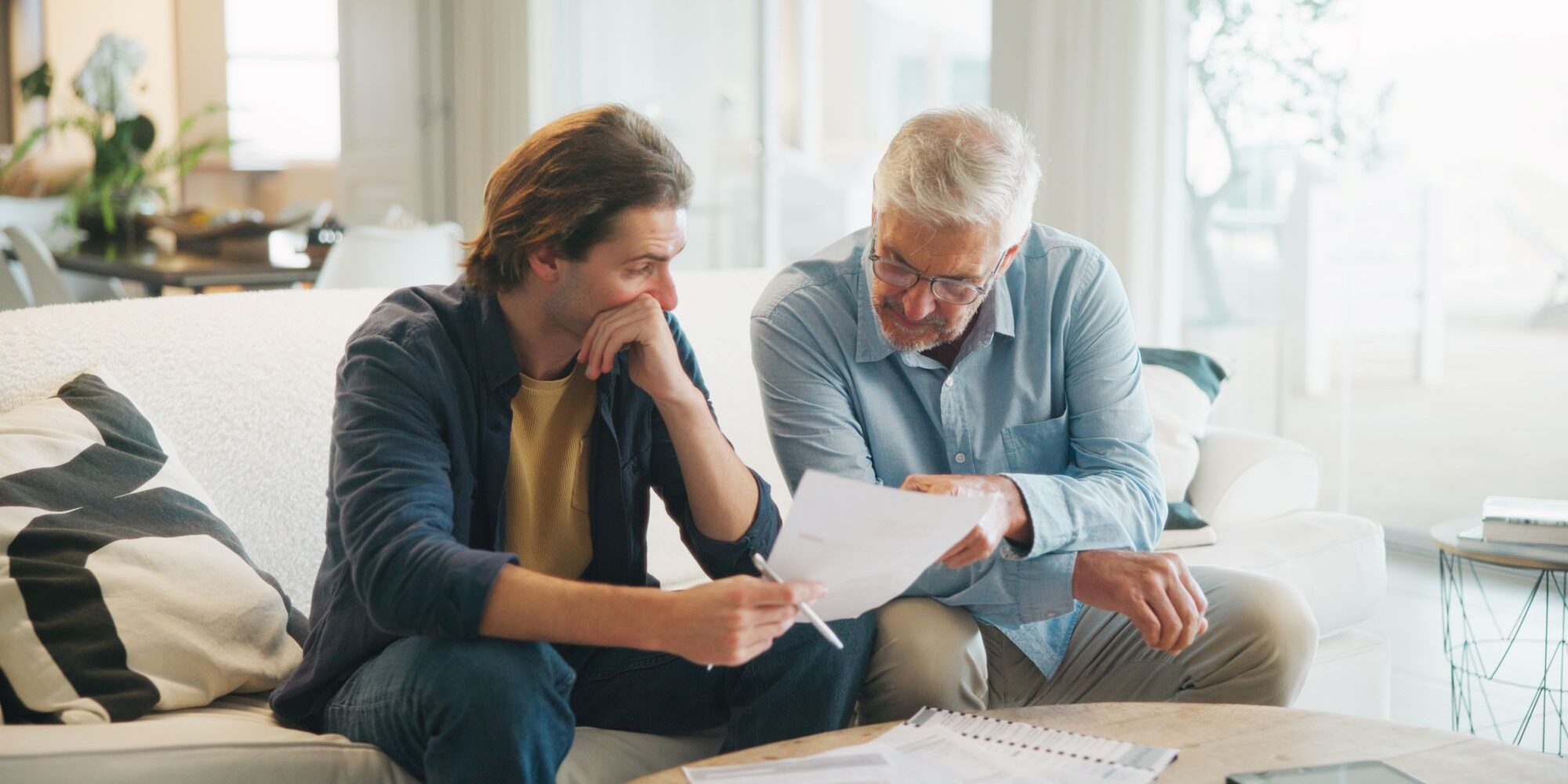 adults looking at paperwork